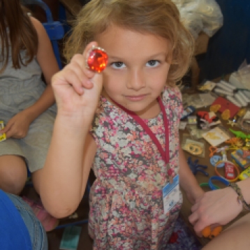 Olivia helping to find the best prizes at our children's ministry room during Med-Fest.